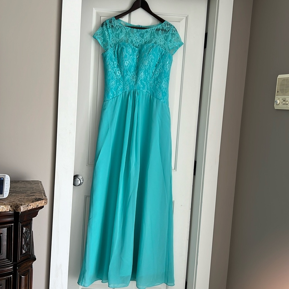 Beautiful mint green long gown. New without tags but never worn.